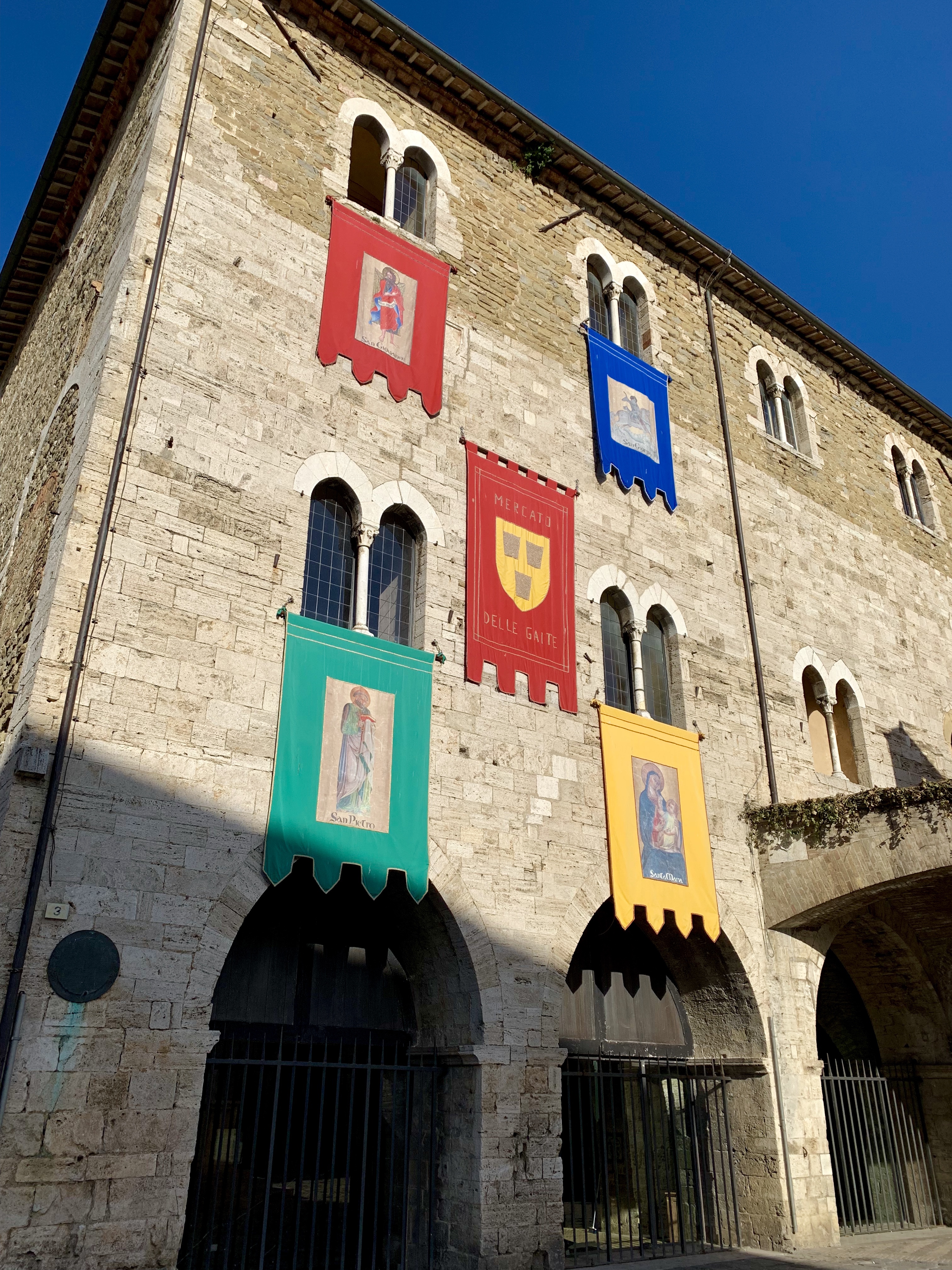 Crest banners on Bevagna’s central square