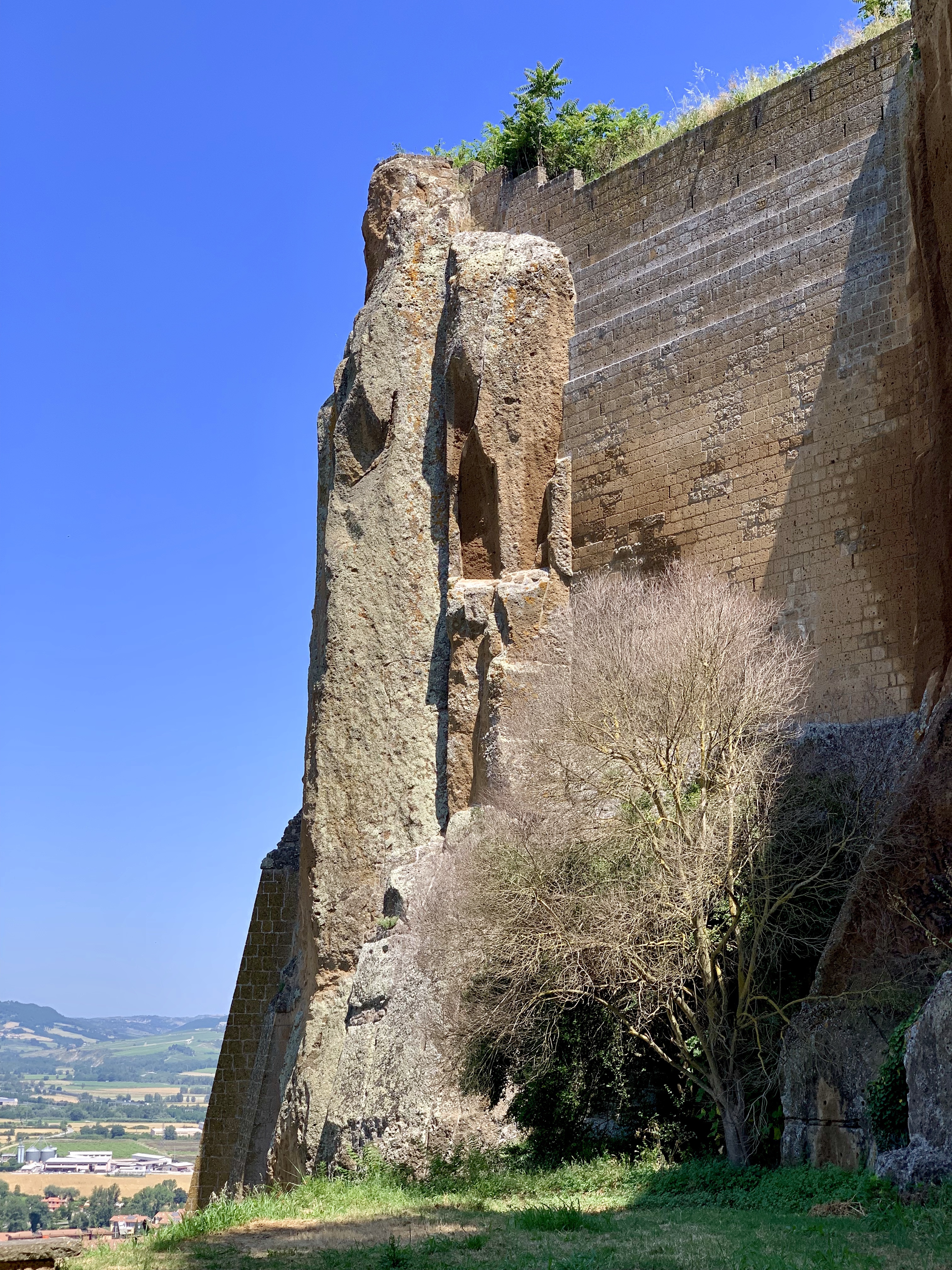 Man-made wall joins ancient rock