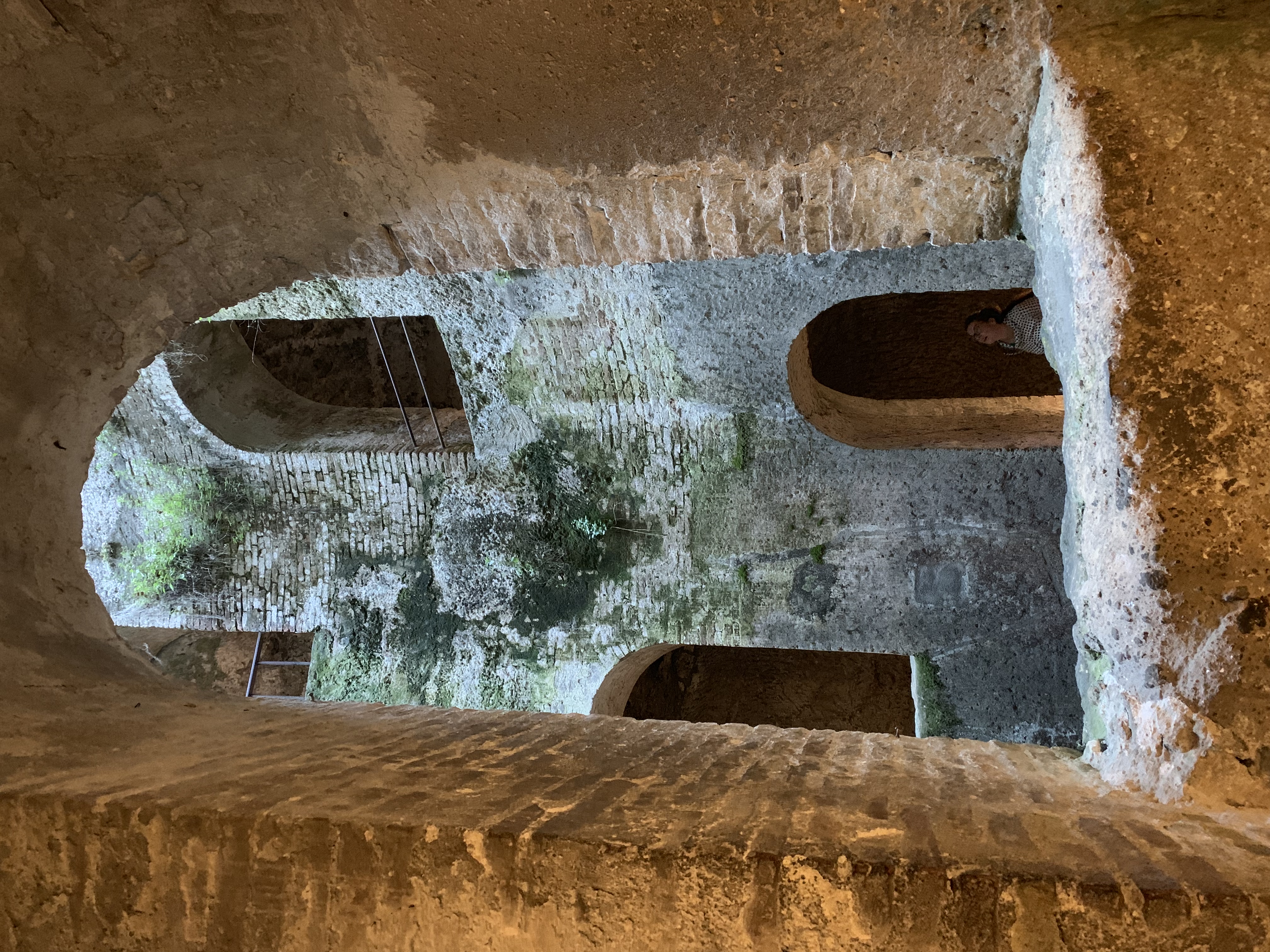 A view across the well at the paths going up and down