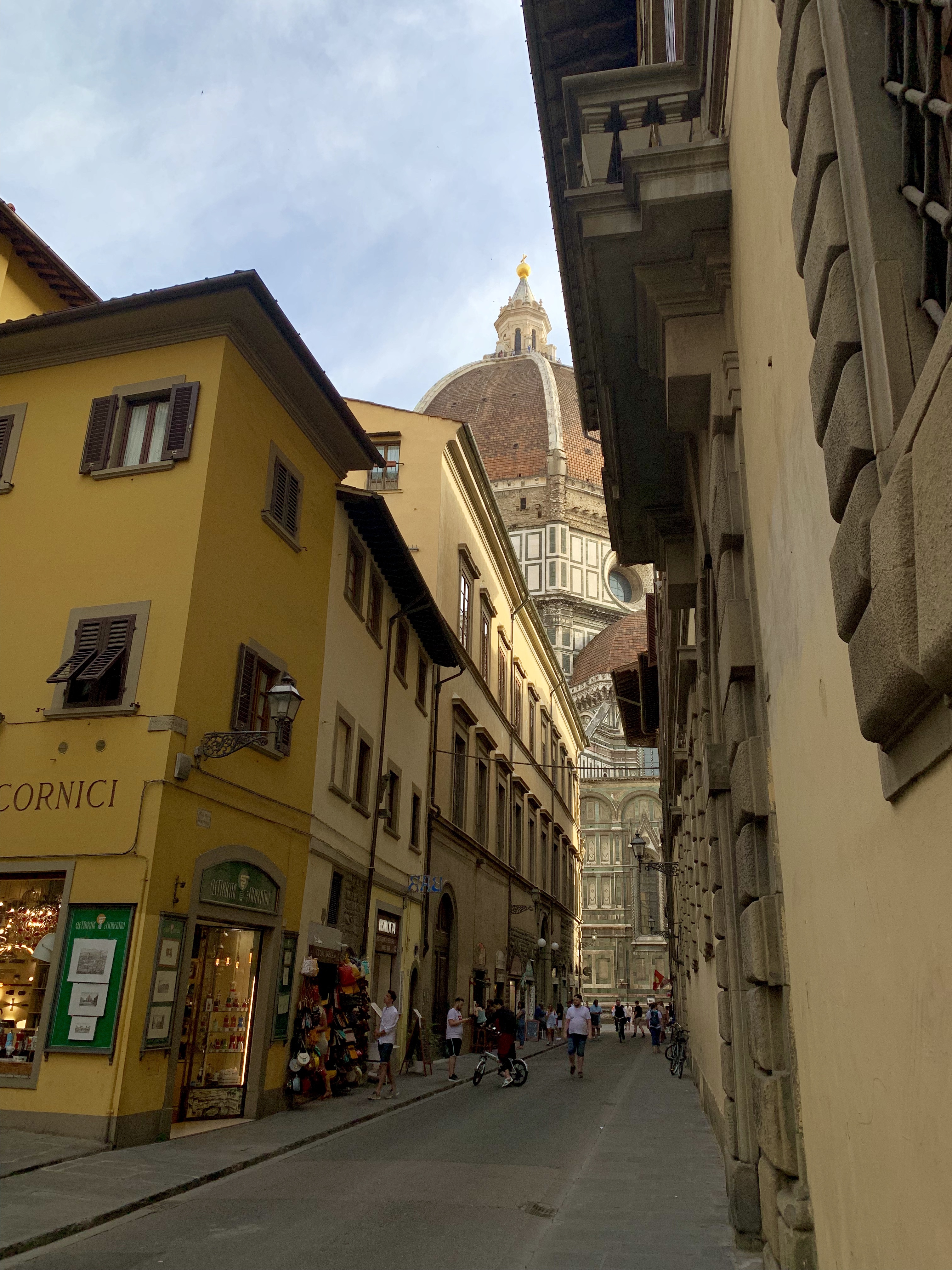 Florence’s Duomo looming over a narrow side street